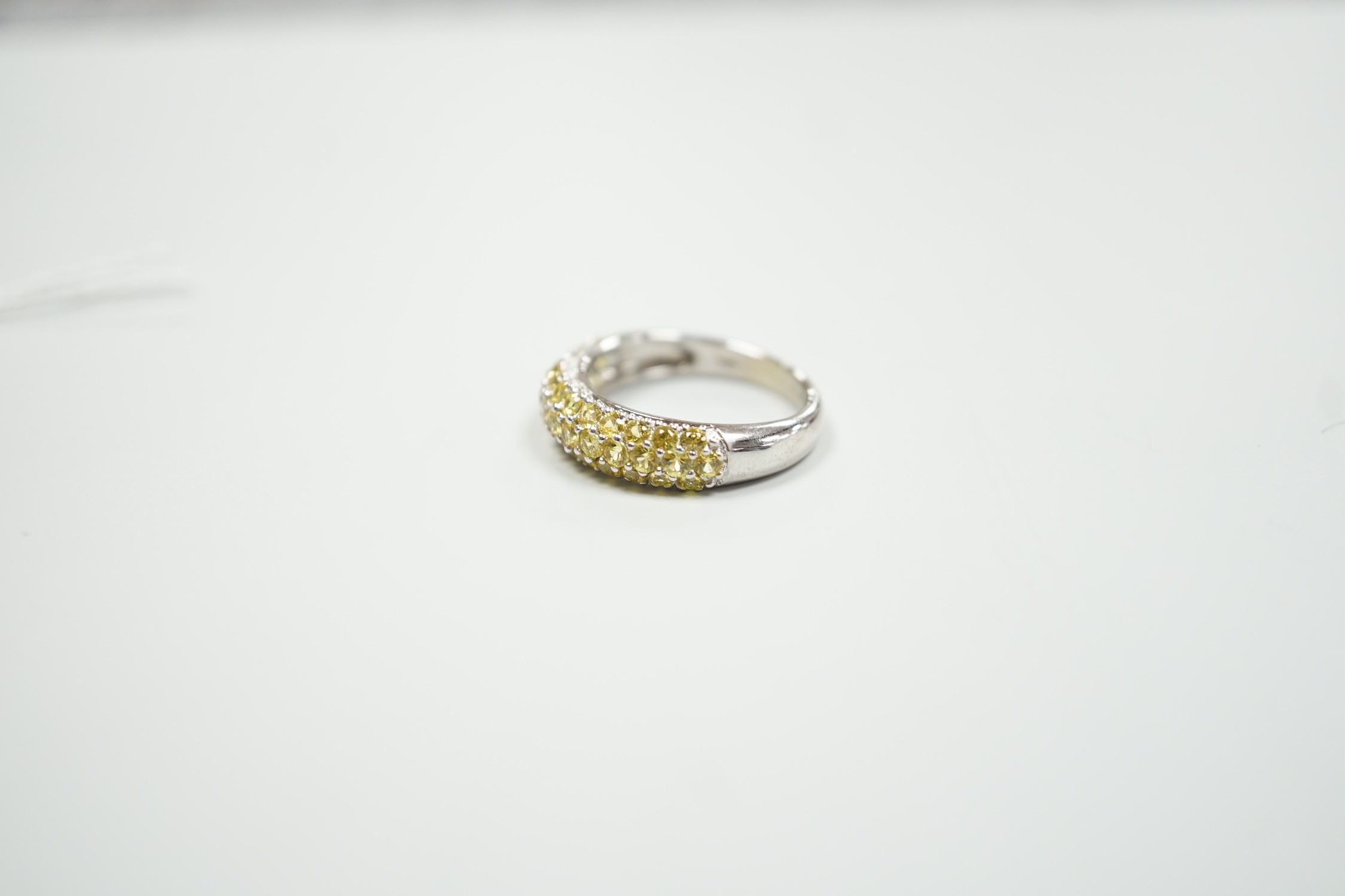 A modern 18ct white gold and yellow stone cluster set half hoop ring, size K, gross weight 4.2 grams.